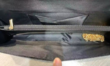 Black buckle clutch